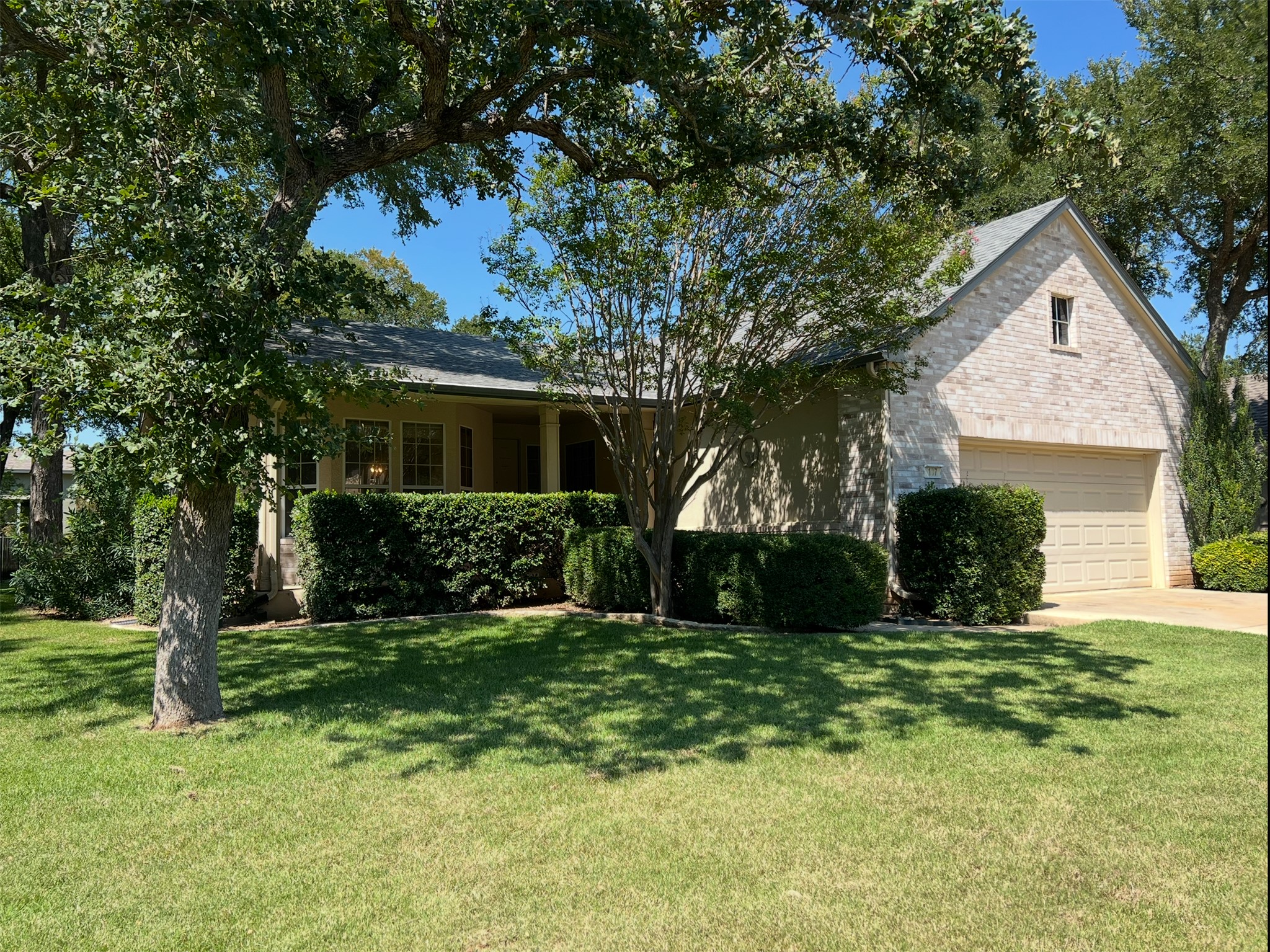 Beautiful shaded yard and lovely front porch accent the curb appeal.