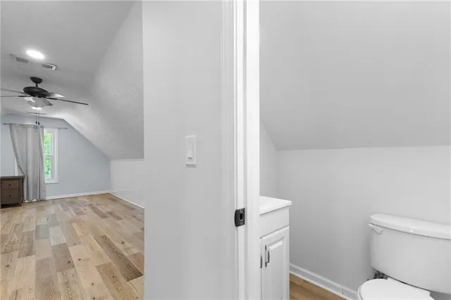 a view of a hallway with white walls