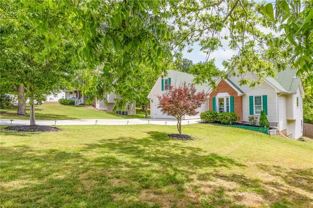 a house with swimming pool in front of it