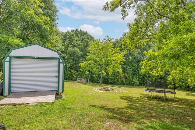 a view of a swimming pool with an outdoor space and seating area