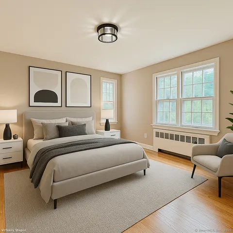 a spacious bedroom with a bed and a couch