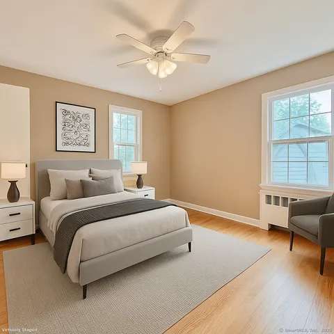 a spacious bedroom with a bed and a couch