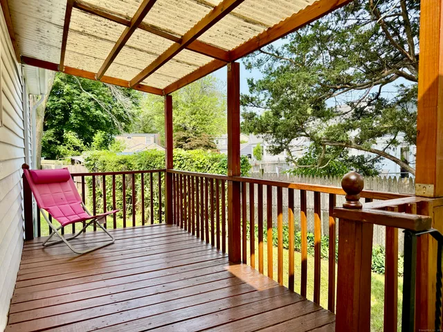 a view of balcony with furniture