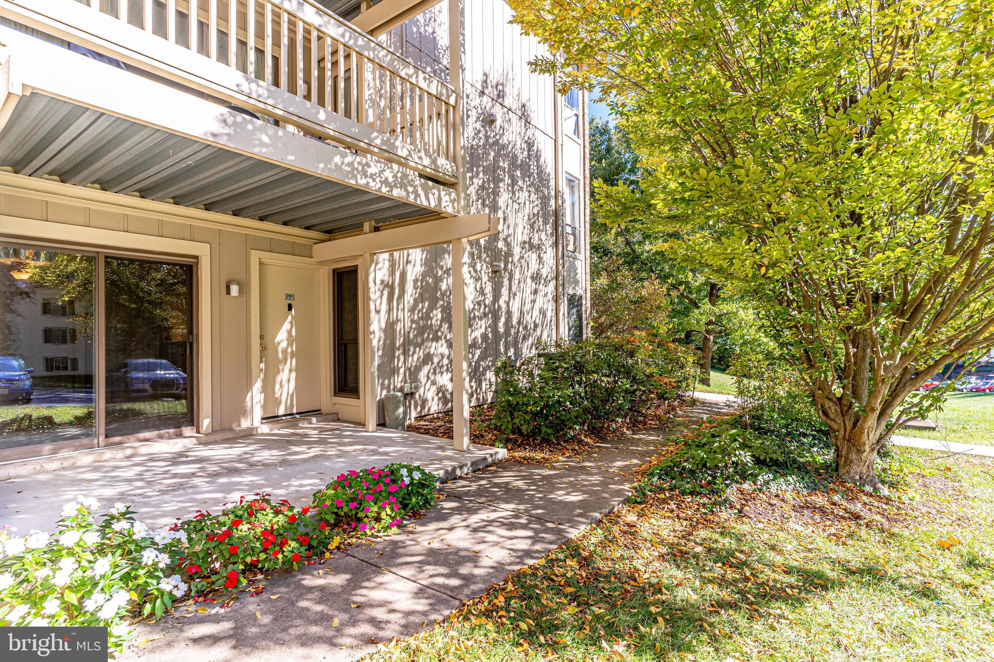 5765 Rexford Court, Unit 5765I Springfield, VA 22152 - Photo 4 of 57 Spacious Patio Overlooking Lush Common Area