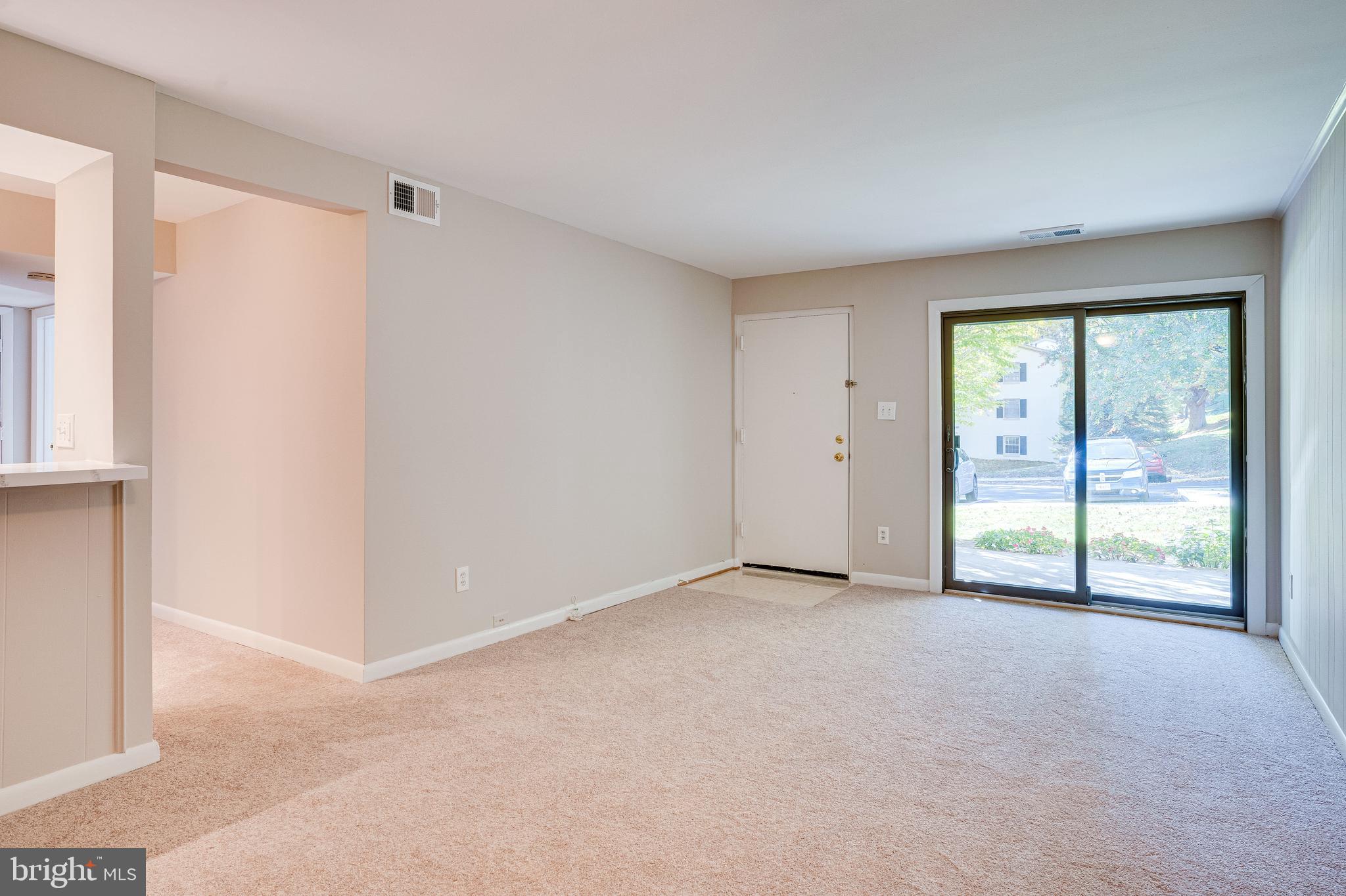 5765 Rexford Court, Unit 5765I Springfield, VA 22152 - Photo 8 of 57 Living Room with Sliding Glass Door to Patio