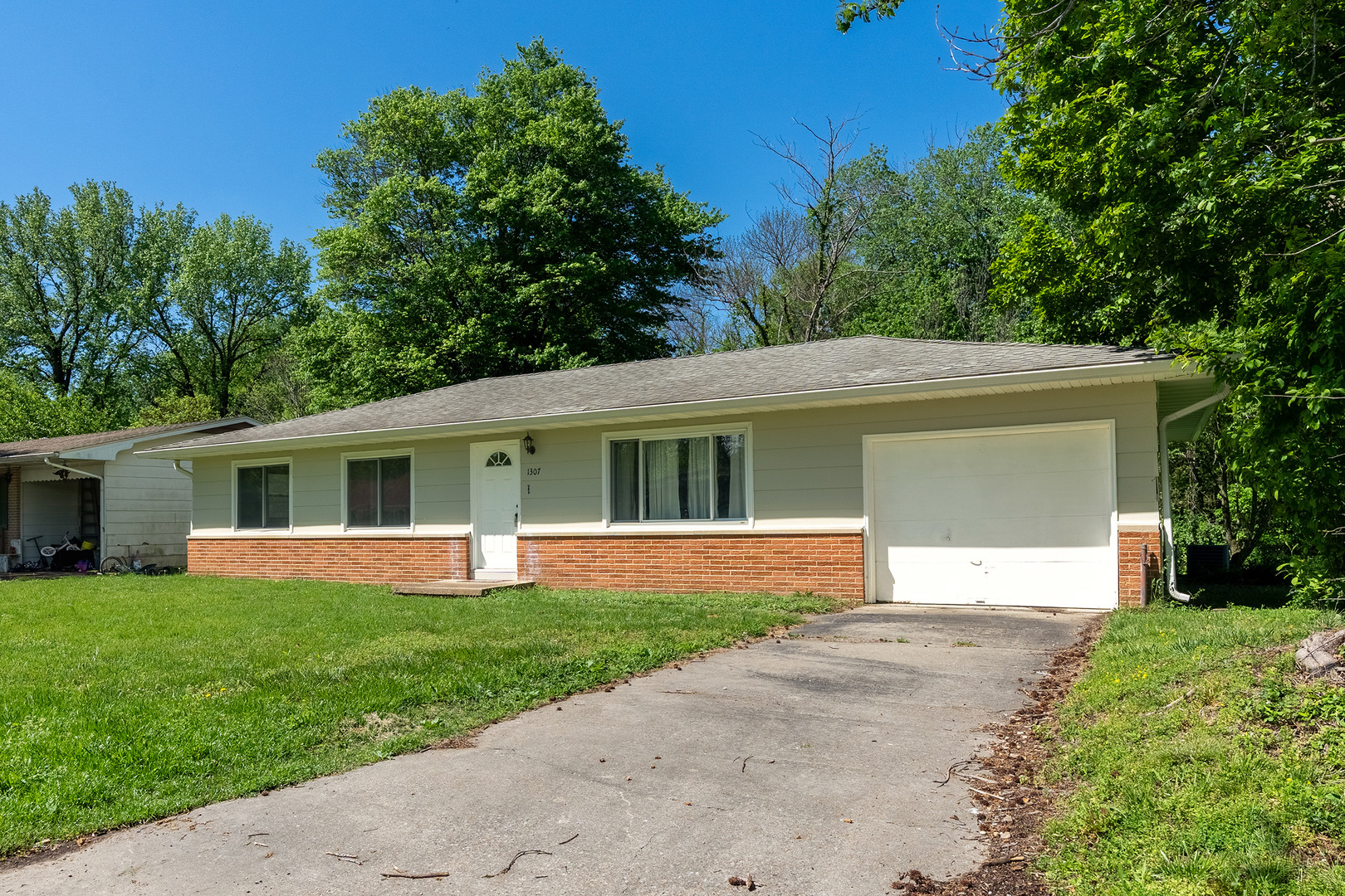 front view of a house and a yard