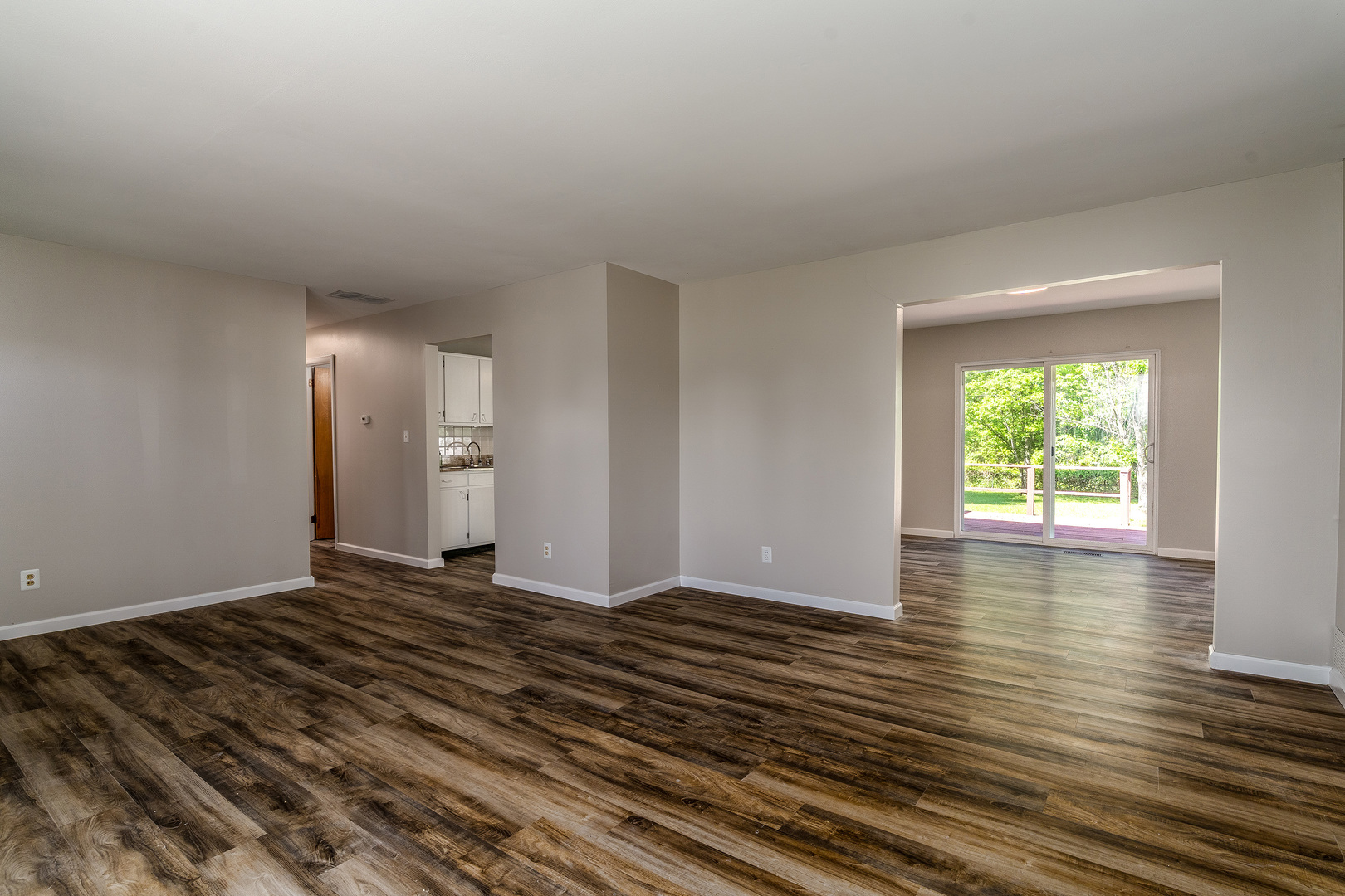 1307 North 16th Street Murphysboro, IL 62966 - Photo 12 of 27 an empty room with wooden floor and windows