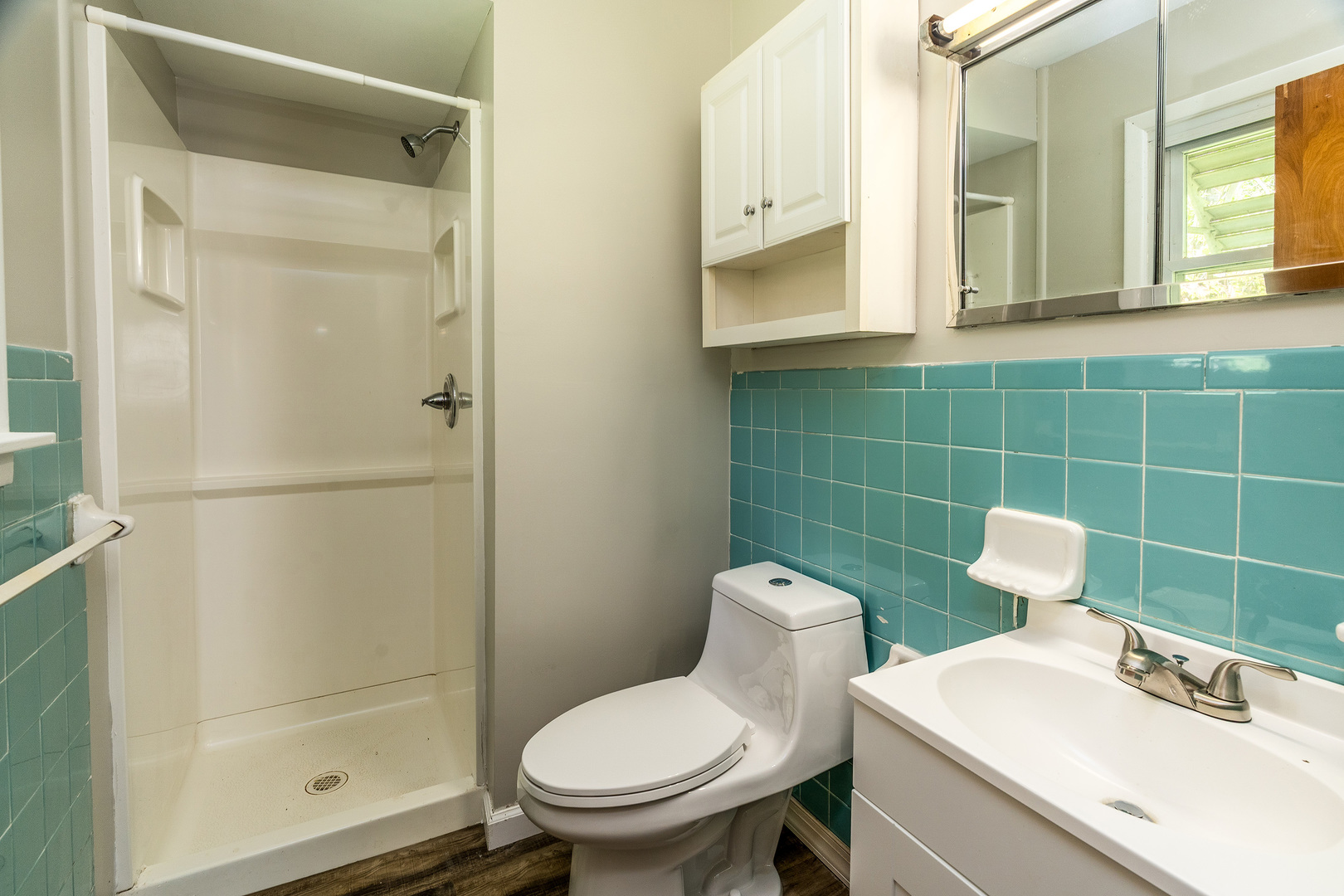 1307 North 16th Street Murphysboro, IL 62966 - Photo 15 of 27 a bathroom with a sink mirror toilet and shower