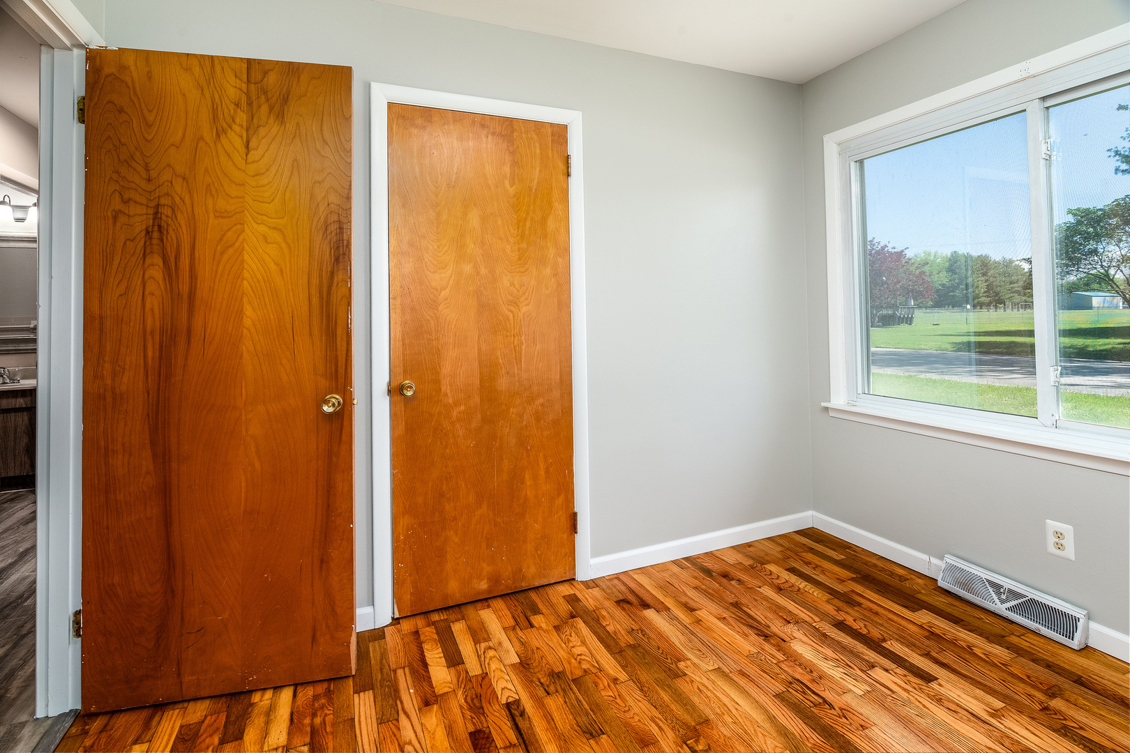 1307 North 16th Street Murphysboro, IL 62966 - Photo 19 of 27 a view of a bedroom with wooden floor and bathroom