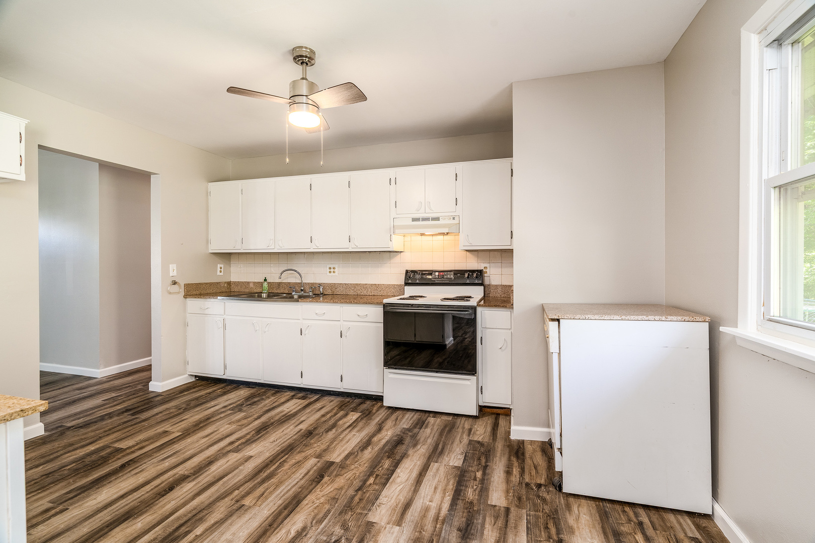 1307 North 16th Street Murphysboro, IL 62966 - Photo 8 of 27 a kitchen with granite countertop white cabinets and white appliances