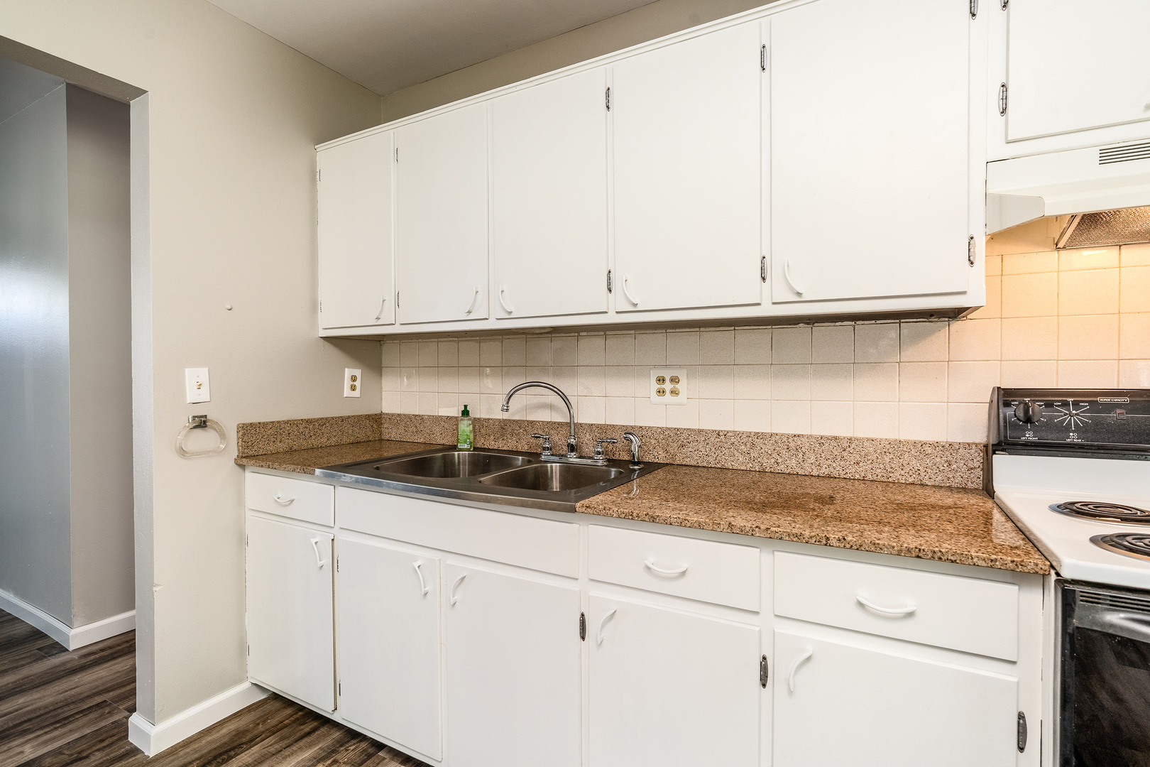 1307 North 16th Street Murphysboro, IL 62966 - Photo 9 of 27 a kitchen with granite countertop a sink and cabinets