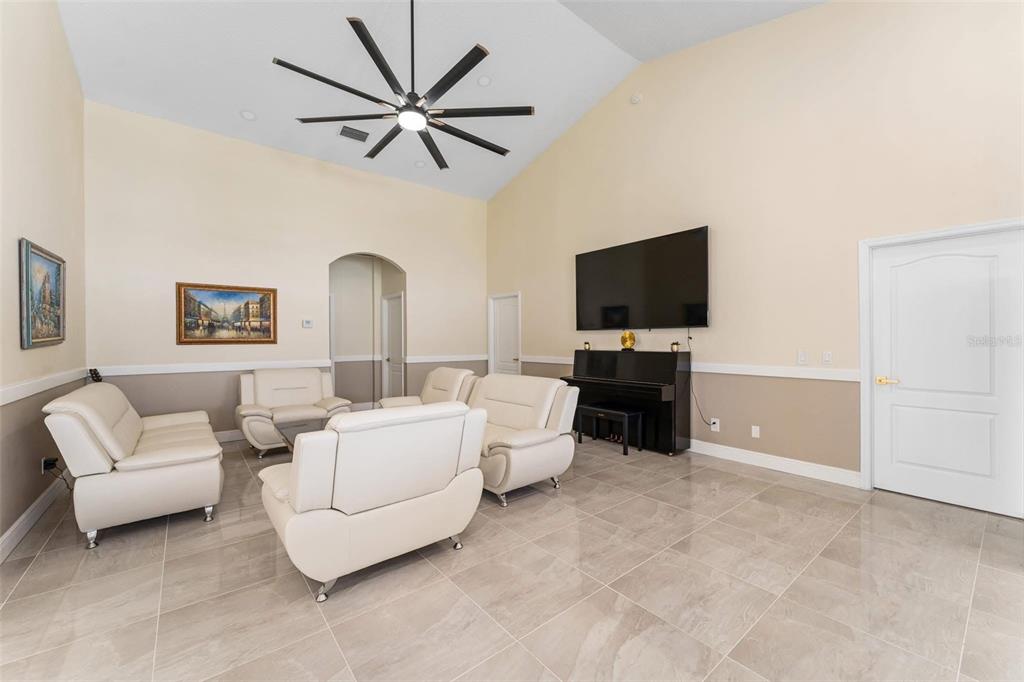 2832 Rodeo Drive Kissimmee, FL 34746 - Photo 14 of 46 a living room with furniture and a flat screen tv