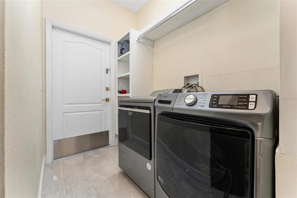 2832 Rodeo Drive Kissimmee, FL 34746 - Photo 22 of 46 a utility room with washer and dryer