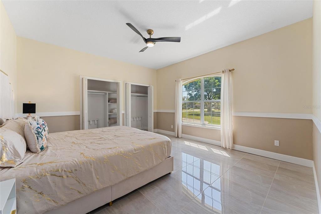 2832 Rodeo Drive Kissimmee, FL 34746 - Photo 31 of 46 a bedroom with a large bed and a window