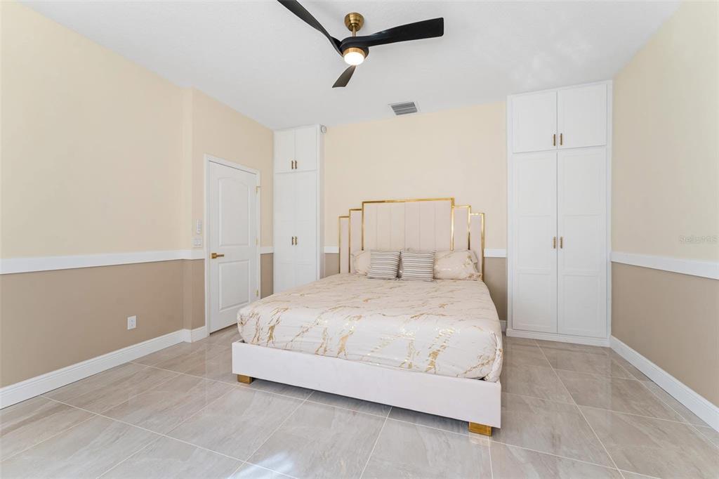 2832 Rodeo Drive Kissimmee, FL 34746 - Photo 36 of 46 a bedroom with a bed and a window
