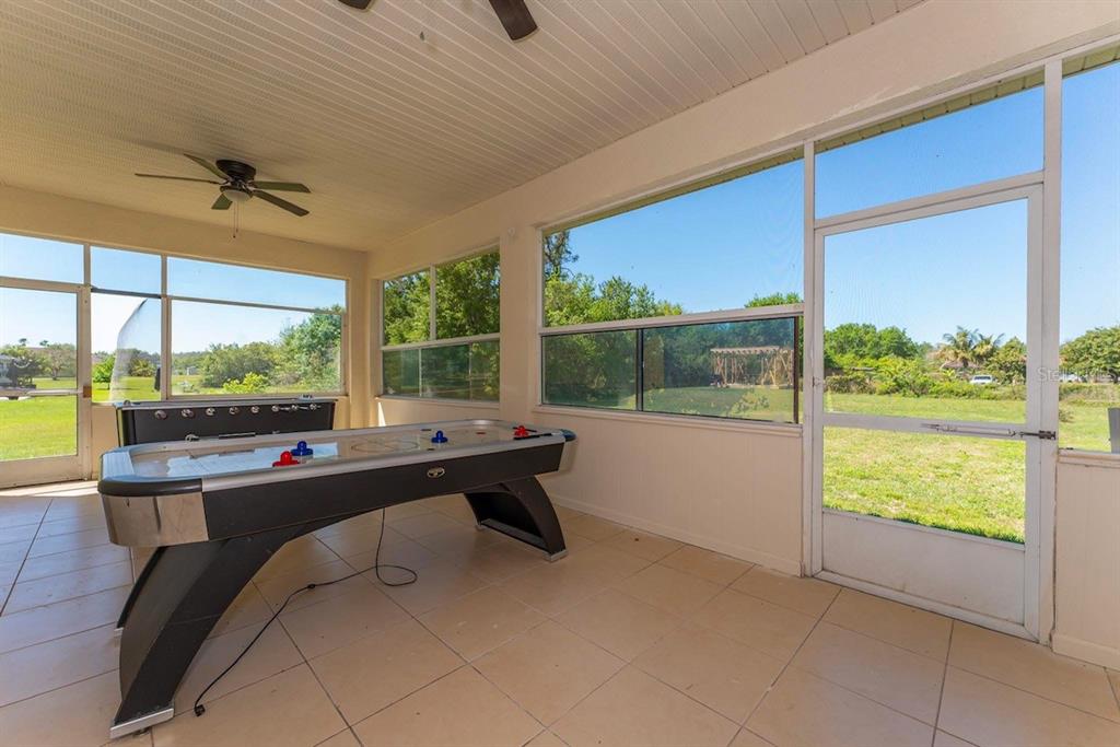 2832 Rodeo Drive Kissimmee, FL 34746 - Photo 37 of 46 a room with pool table and large windows