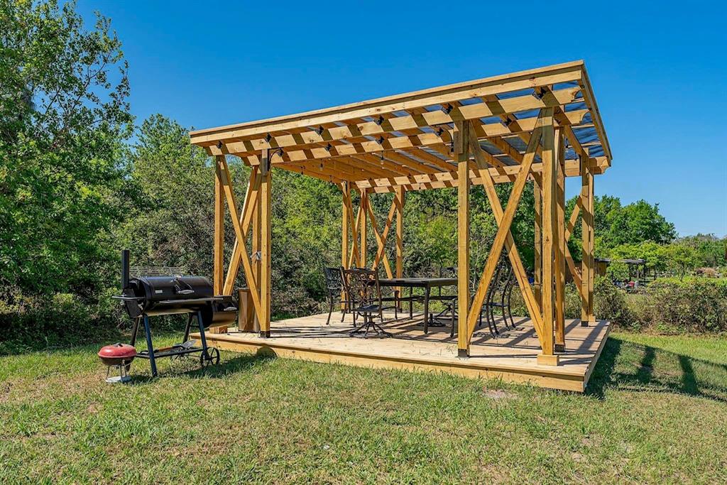 2832 Rodeo Drive Kissimmee, FL 34746 - Photo 38 of 46 a view of swimming pool with a bench and trees