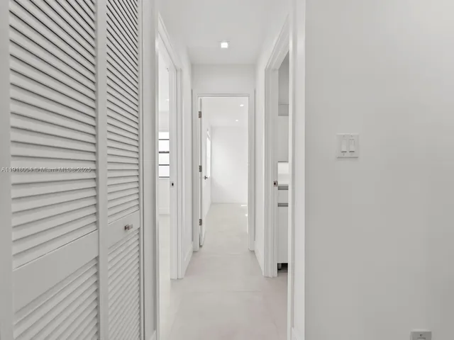 a view of a bathroom from the hallway