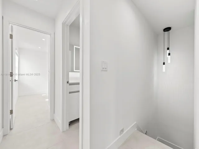 a bathroom with a granite countertop shower