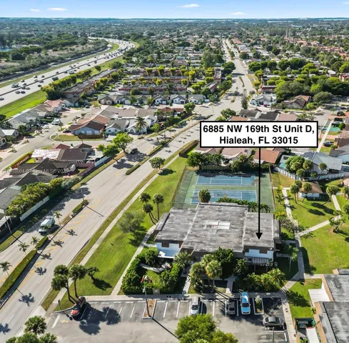 an aerial view of residential houses with outdoor space