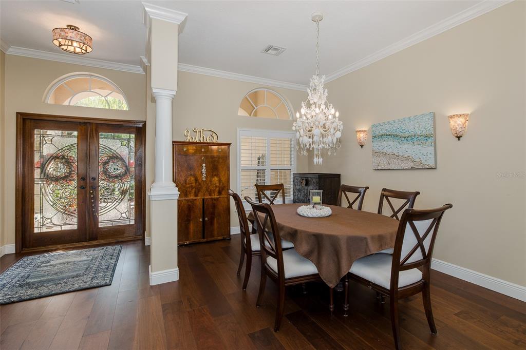 2928 Waters Edge Road Palm Harbor, FL 34685 - Photo 12 of 52 a view of a dining room with furniture window and wooden floor