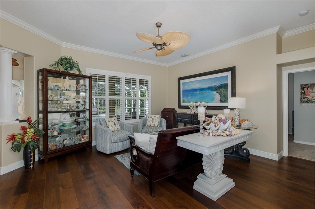 2928 Waters Edge Road Palm Harbor, FL 34685 - Photo 13 of 52 a living room with furniture and a floor to ceiling window