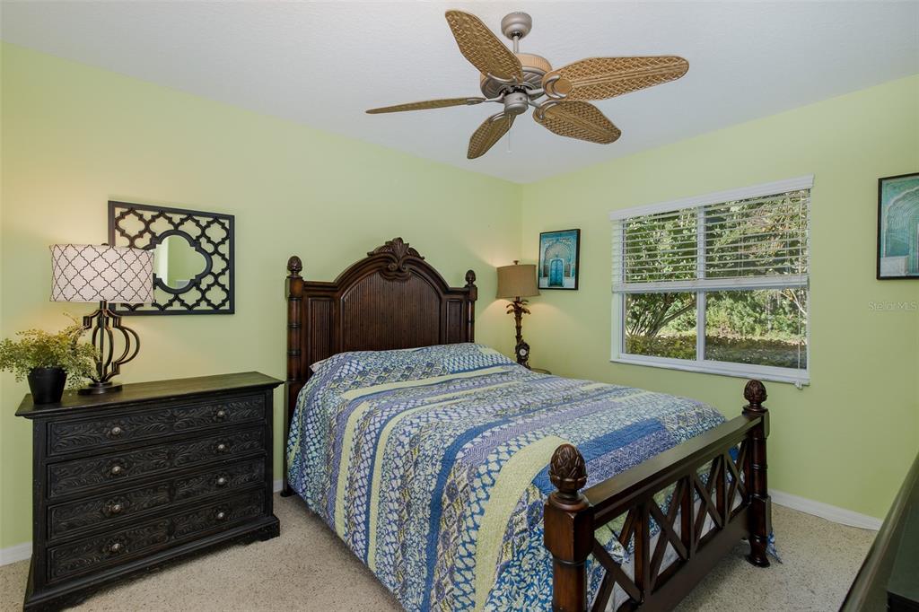 2928 Waters Edge Road Palm Harbor, FL 34685 - Photo 26 of 52 a bedroom with a bed and a window