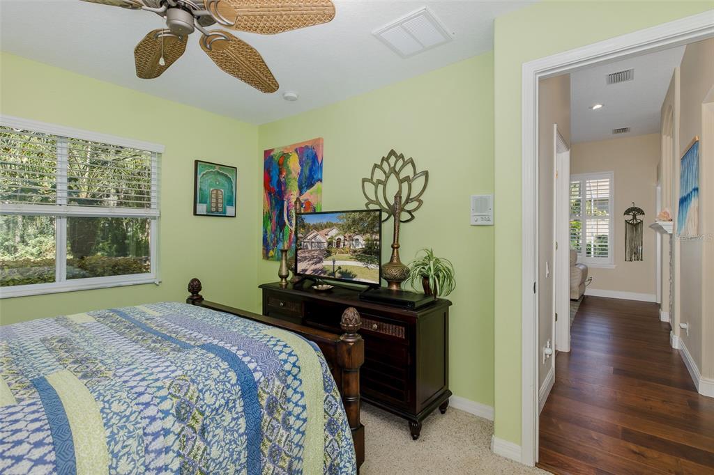 2928 Waters Edge Road Palm Harbor, FL 34685 - Photo 28 of 52 a bedroom with a bed and a window