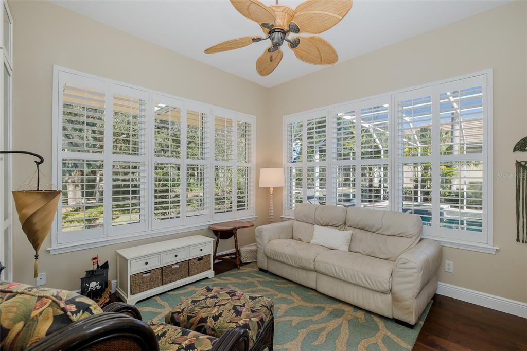 2928 Waters Edge Road Palm Harbor, FL 34685 - Photo 30 of 52 a bedroom with furniture and a large window