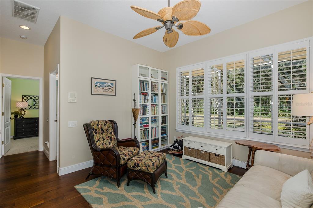 2928 Waters Edge Road Palm Harbor, FL 34685 - Photo 31 of 52 a living room with furniture and a large window