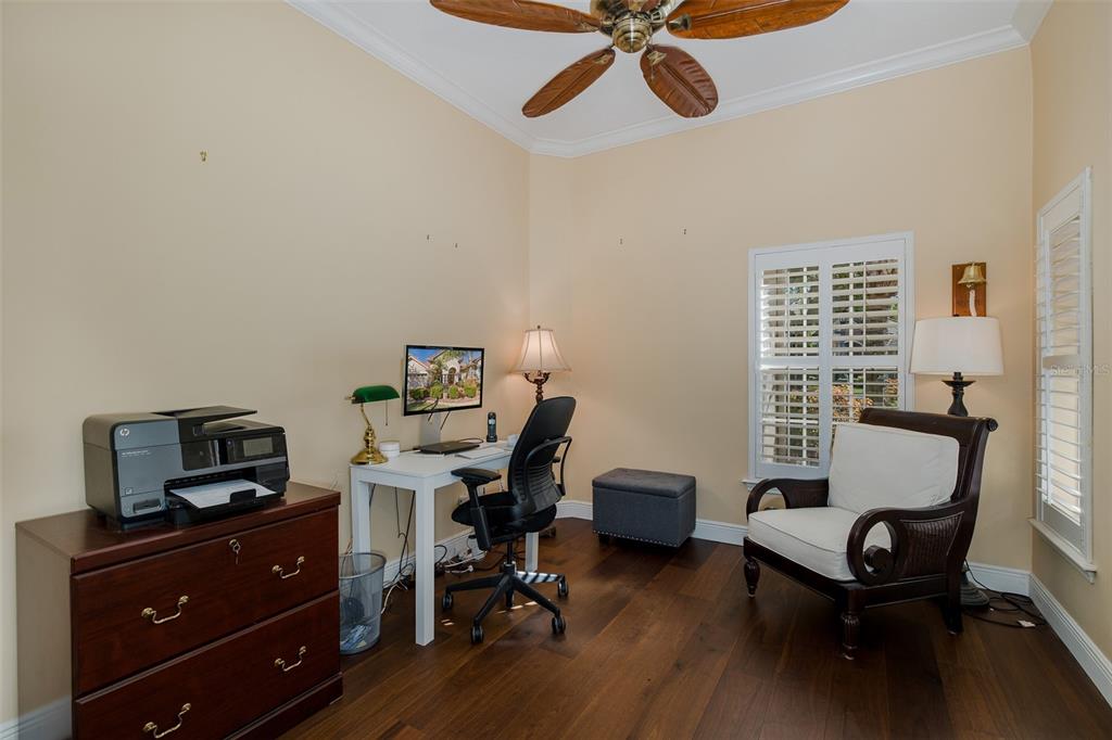 2928 Waters Edge Road Palm Harbor, FL 34685 - Photo 37 of 52 a view of a workspace with furniture and a window