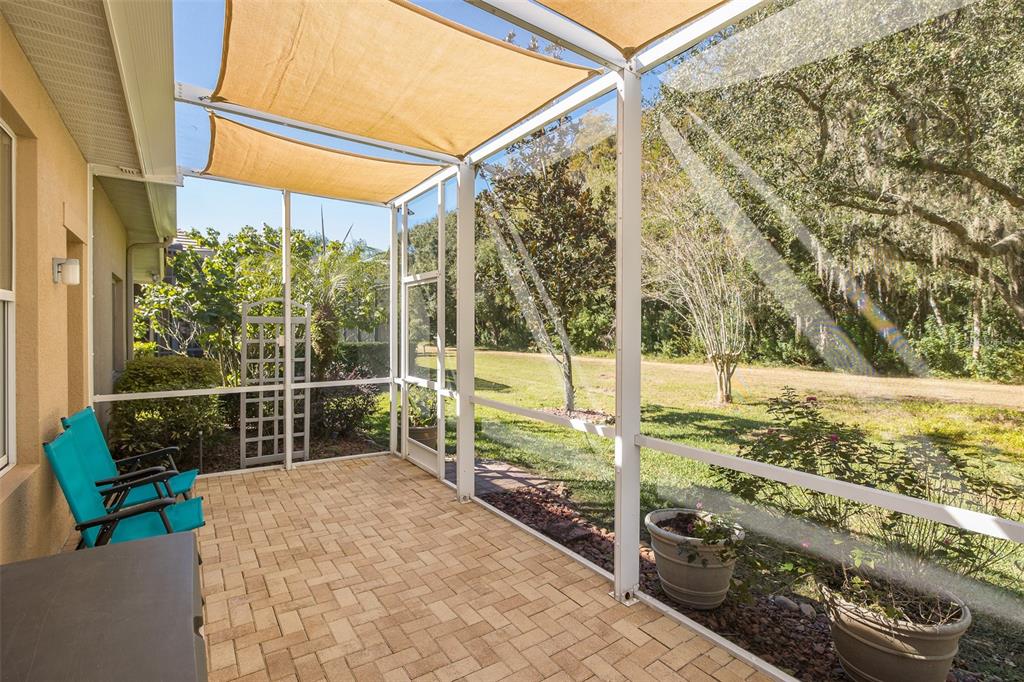 2928 Waters Edge Road Palm Harbor, FL 34685 - Photo 44 of 52 a view of a porch with wooden floor