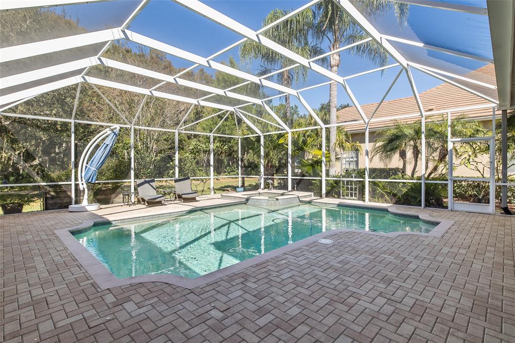 2928 Waters Edge Road Palm Harbor, FL 34685 - Photo 46 of 52 a view of a backyard with a swimming pool