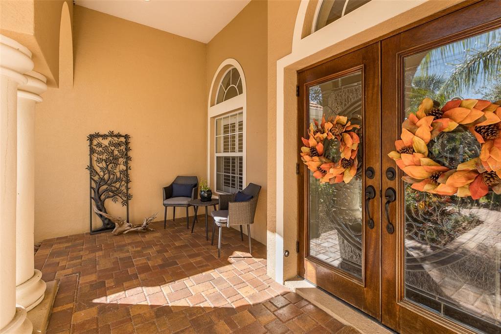 2928 Waters Edge Road Palm Harbor, FL 34685 - Photo 10 of 52 a view of a bedroom with a table and chairs