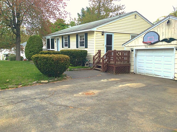 22 Inwood Road Rutland, MA 01543 - Photo 1 of 23 a view of a house with a yard and garage