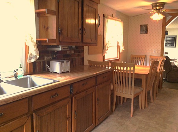 22 Inwood Road Rutland, MA 01543 - Photo 6 of 23 a view of a kitchen area with furniture and chandelier