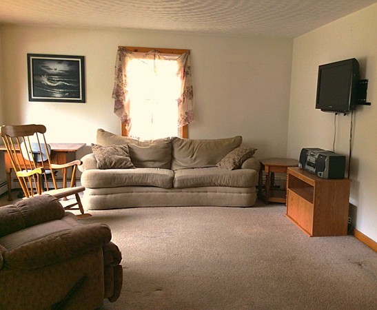 22 Inwood Road Rutland, MA 01543 - Photo 9 of 23 a living room with furniture and a flat screen tv