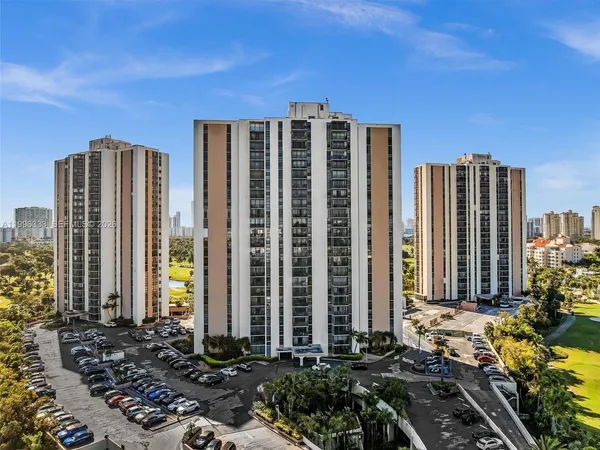 a view of a building with a yard