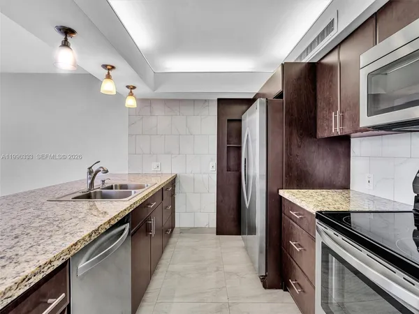 a kitchen with a stove and a microwave