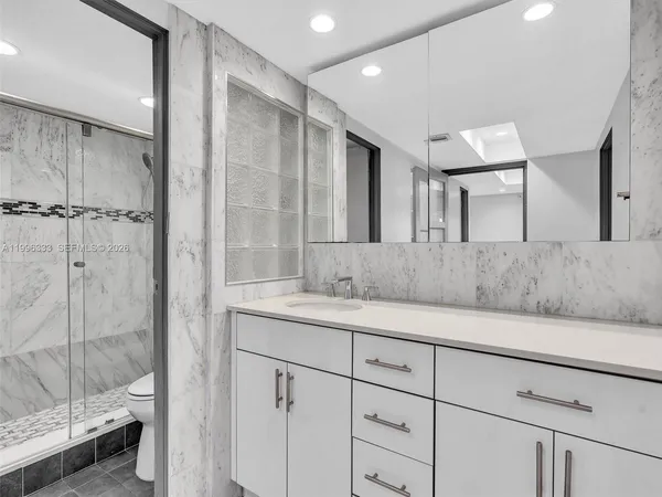 a bathroom with a shower and a toilet