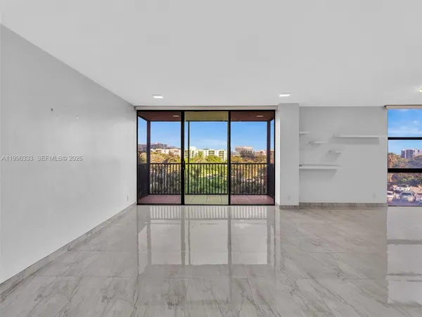 a view of an empty room with a window