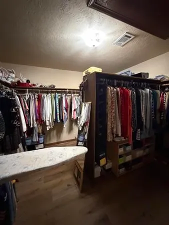 view of a hallway with wooden floor