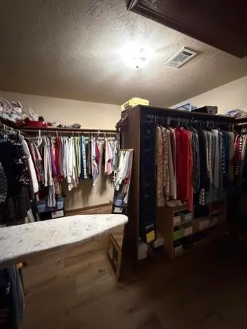 view of a hallway with wooden floor