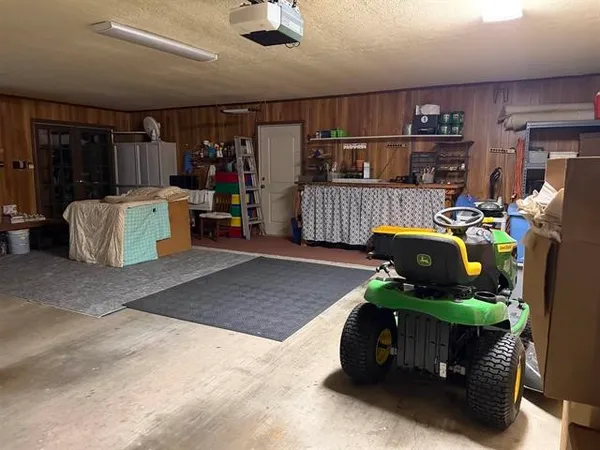 a view of a house with yard and porch