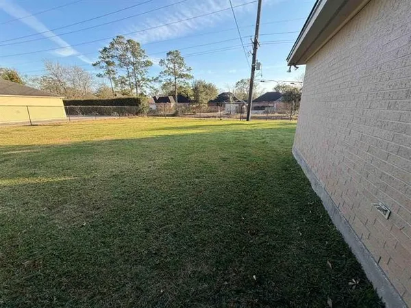 a view of a golf course with a tree