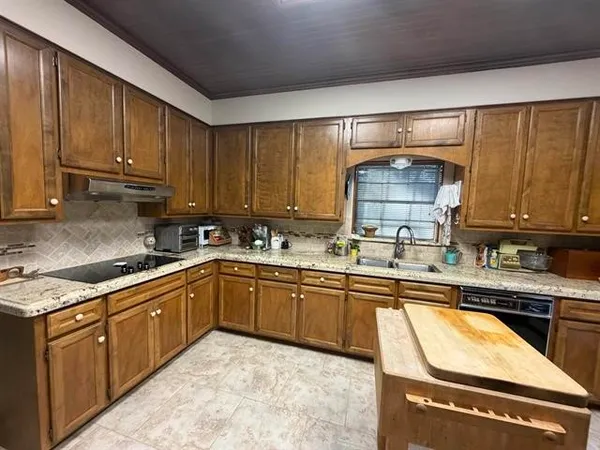 a kitchen with a stove and a refrigerator