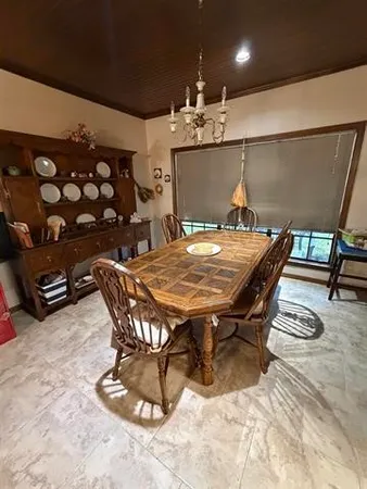 a spacious bedroom with a large bed and wooden floor