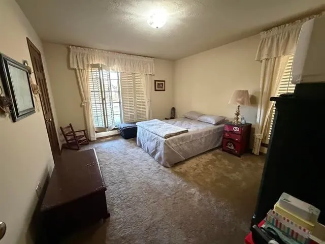a bedroom with a bed and furniture