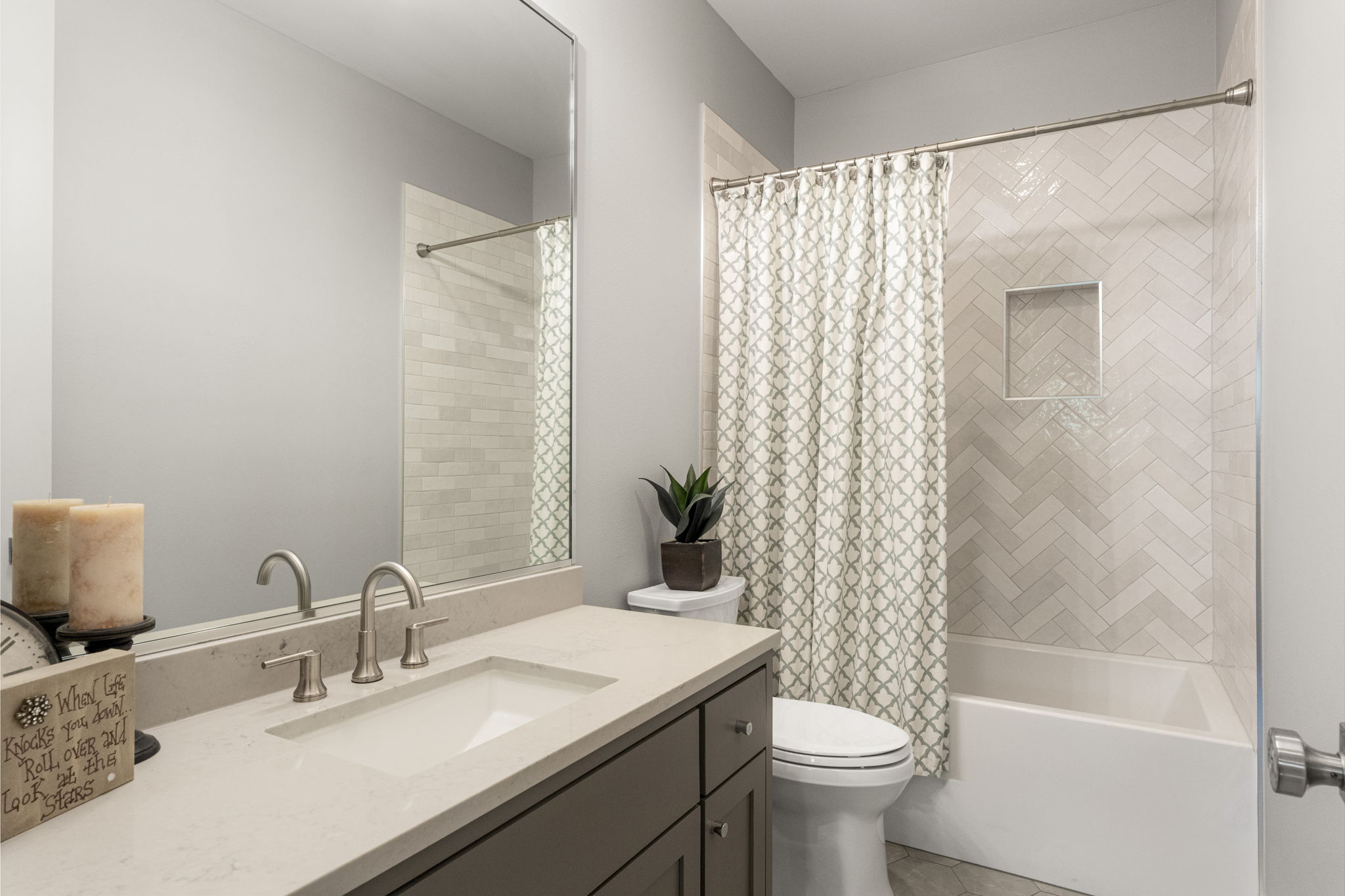 3814 Ridgelea Drive, Unit A Austin, TX 78731 - Photo 27 of 30 a bathroom with a granite countertop sink a toilet and a mirror