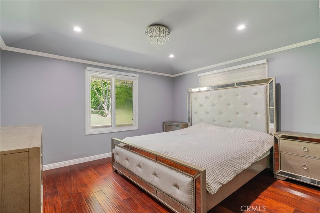 660 Woodbury Road Glendale, CA 91206 - Photo 15 of 45 a bedroom with a large bed and a window